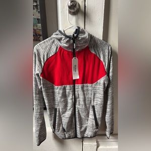 Hi! this sweater was never worn, no tears, and the brand tag is still attached.